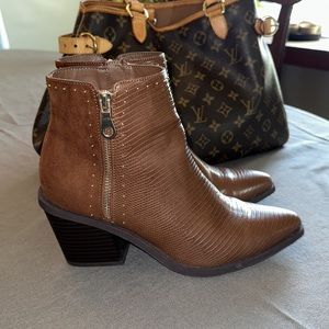 Brown ankle booties with gold studs and gold zipper